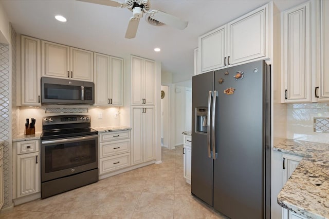 kitchen featuring light tile patterned flooring, recessed lighting, stainless steel appliances, backsplash, and light stone countertops