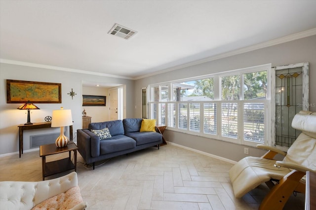 living area with a wealth of natural light, visible vents, and baseboards