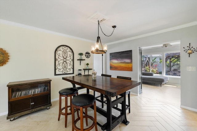 dining room with ornamental molding, baseboards, and a ceiling fan