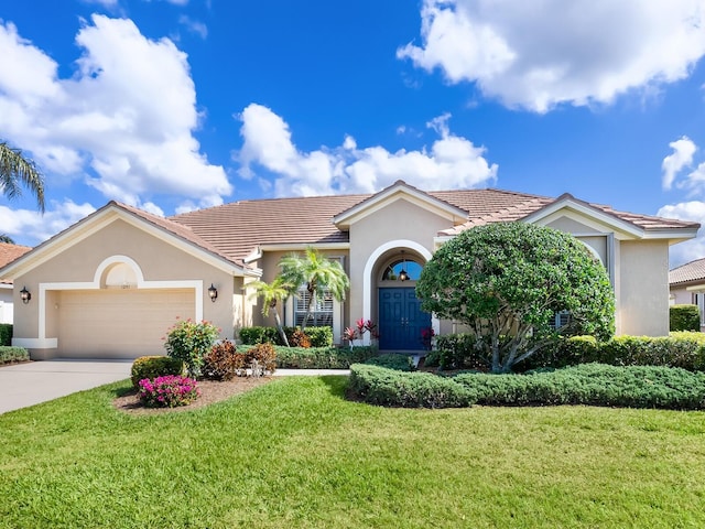 view of front facade featuring a garage and a front lawn