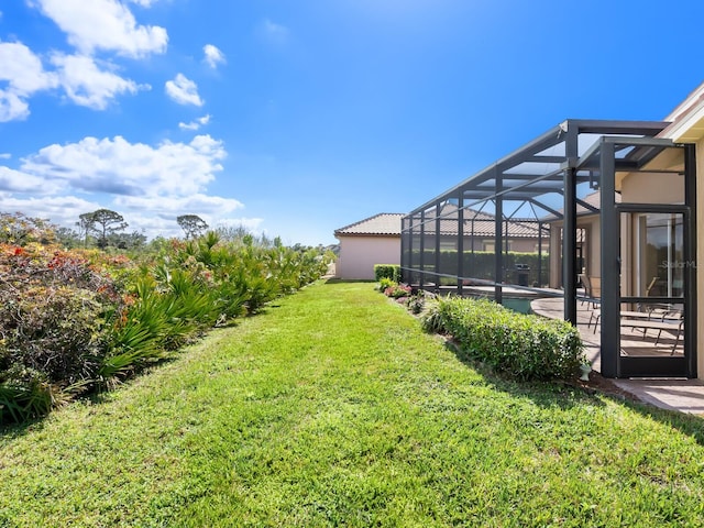 view of yard with a lanai