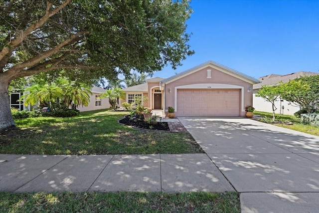 ranch-style home featuring a garage and a front yard