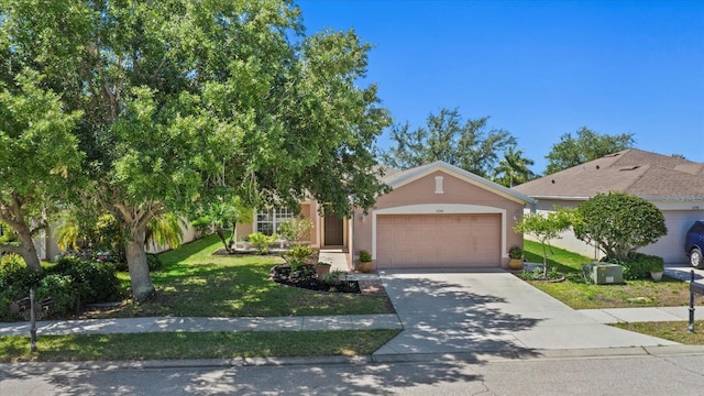 obstructed view of property featuring a garage and a front yard