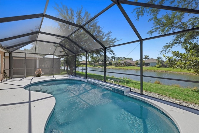 view of pool featuring a patio, a water view, and a lanai