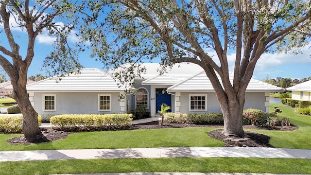 ranch-style home with a front yard