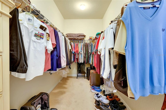 spacious closet with carpet flooring