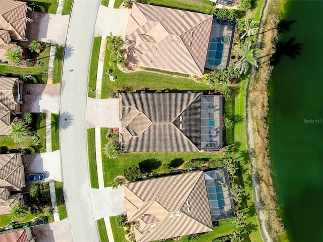 birds eye view of property featuring a water view