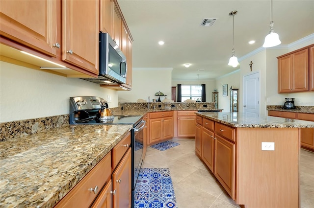 kitchen featuring crown molding, appliances with stainless steel finishes, hanging light fixtures, a center island, and light stone countertops