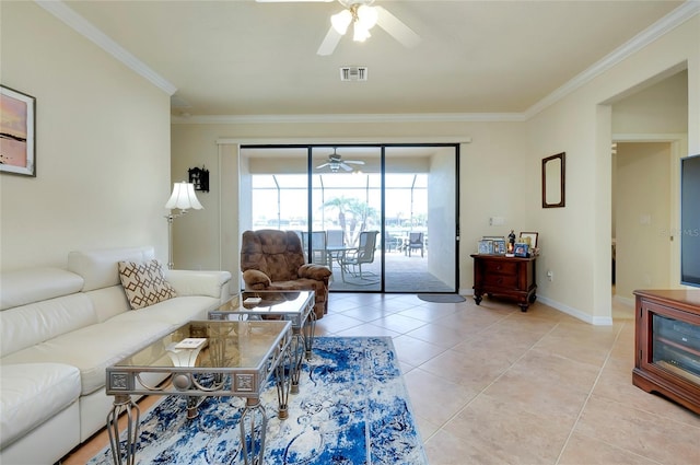 tiled living room with ornamental molding and ceiling fan