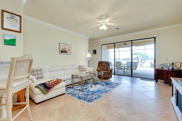 tiled living room with crown molding and ceiling fan