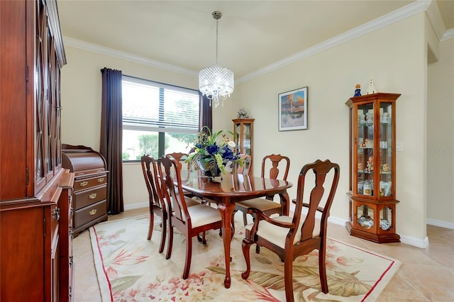 tiled dining area with an inviting chandelier and ornamental molding