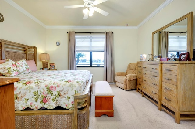 bedroom with multiple windows, crown molding, light carpet, and ceiling fan