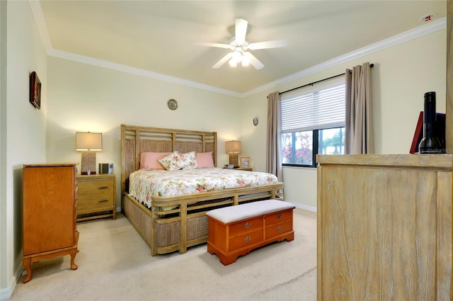 bedroom featuring crown molding, ceiling fan, and light carpet