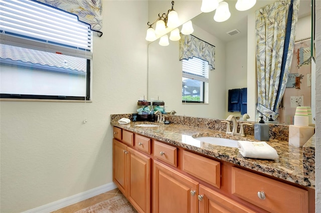 bathroom with vanity and tile patterned flooring