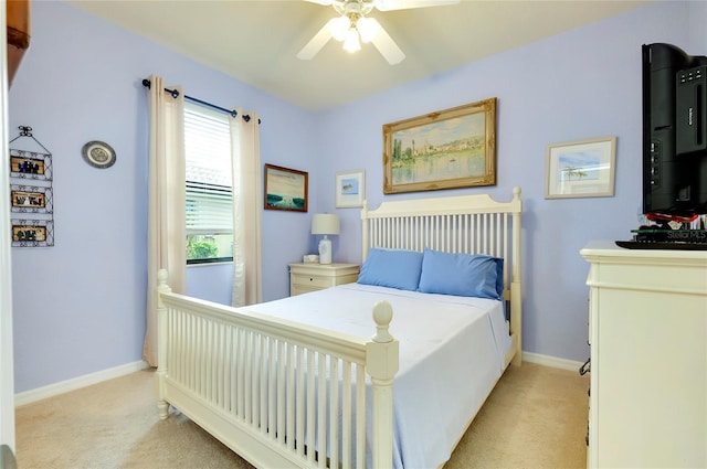 bedroom with light colored carpet and ceiling fan