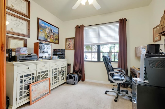 office space with light colored carpet and ceiling fan