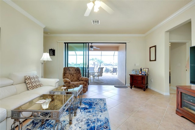 living room featuring crown molding, ceiling fan, and light tile patterned floors