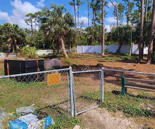 view of yard featuring a gate and fence