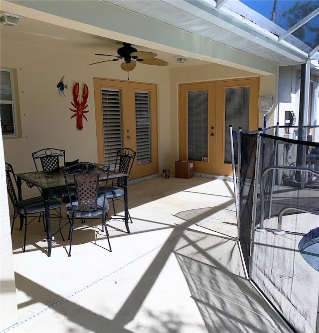 view of patio with visible vents, outdoor dining area, and ceiling fan