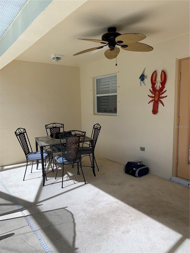 view of patio / terrace with outdoor dining area, visible vents, and a ceiling fan