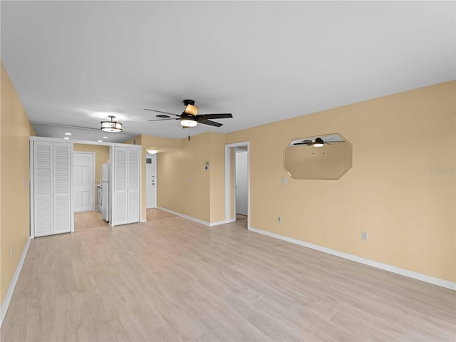 interior space with light hardwood / wood-style flooring and ceiling fan