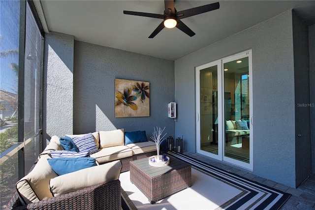 sunroom with a ceiling fan