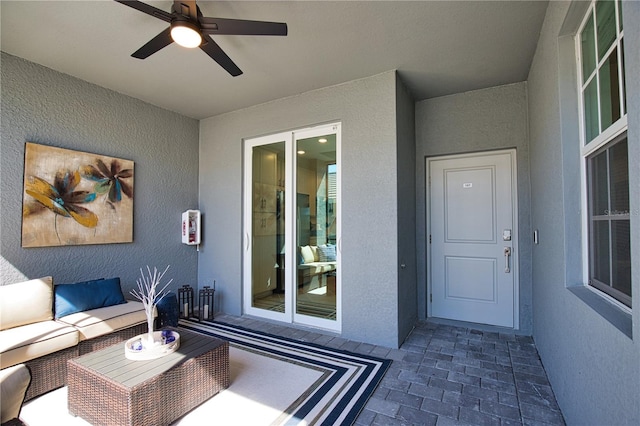 view of patio / terrace featuring a ceiling fan and an outdoor living space