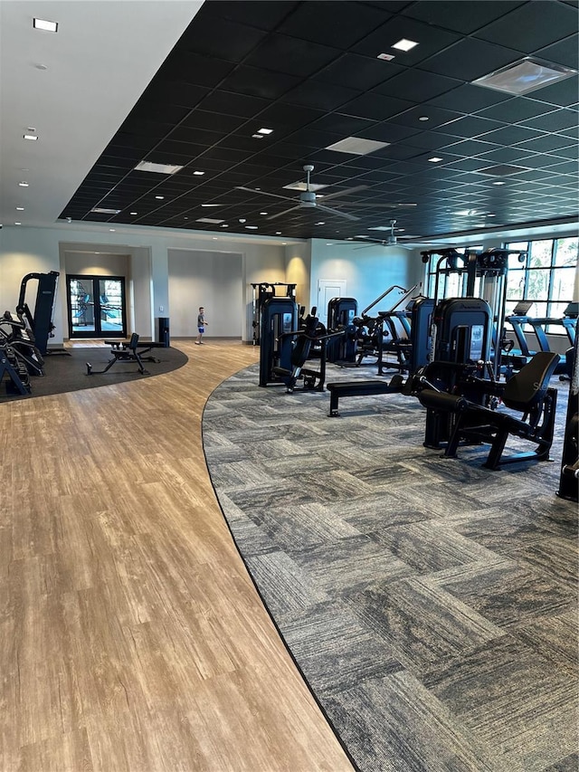 exercise room featuring wood finished floors