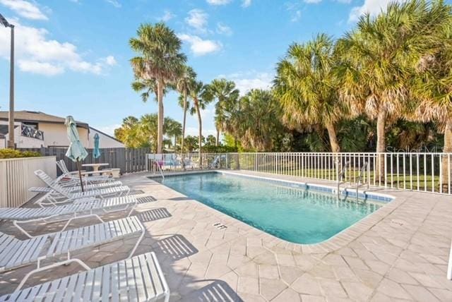 view of swimming pool with a patio area