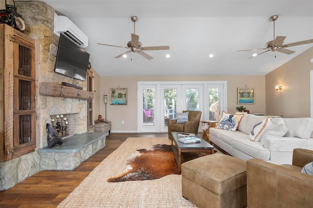 living room featuring hardwood / wood-style flooring, lofted ceiling, a wall mounted air conditioner, and ceiling fan