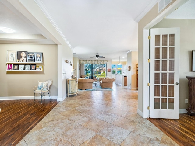 interior space featuring ornamental molding and light wood-type flooring