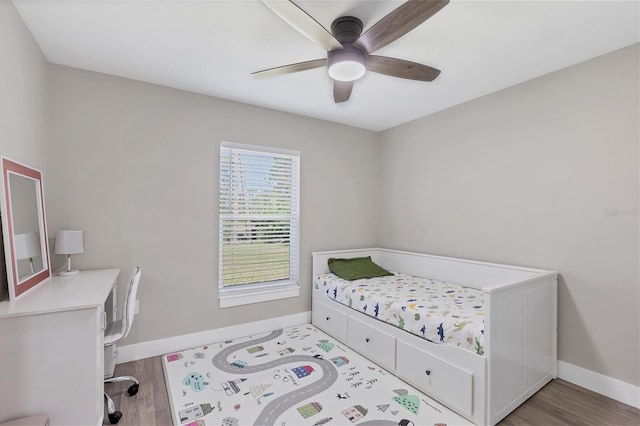 bedroom with ceiling fan and light wood-type flooring