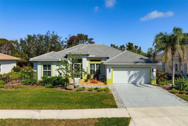 view of front of home featuring a garage and a front lawn