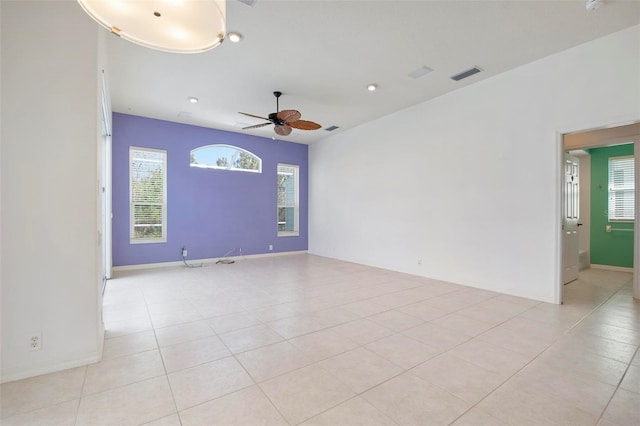 unfurnished room featuring light tile patterned floors and ceiling fan