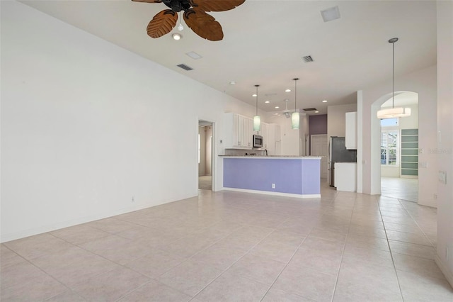 unfurnished living room with light tile patterned floors and ceiling fan