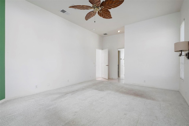 carpeted empty room with ceiling fan