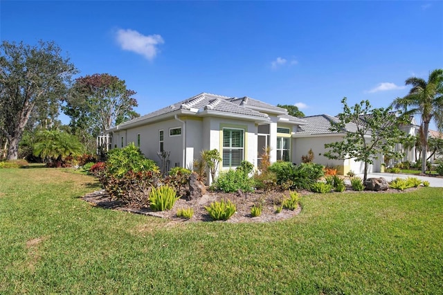 view of property exterior featuring a garage and a yard