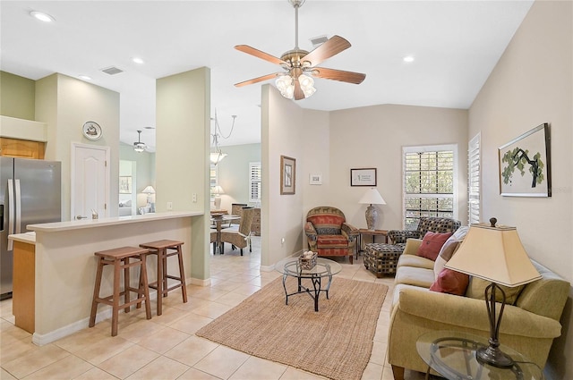 tiled living room featuring vaulted ceiling and ceiling fan