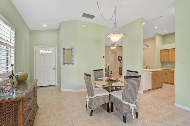 tiled dining space featuring sink