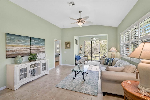 living room with light tile patterned floors, vaulted ceiling, and ceiling fan