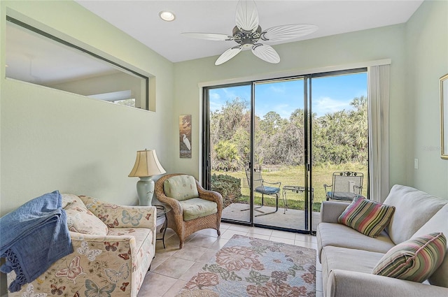 tiled living room with ceiling fan