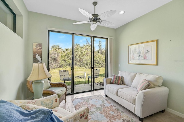 tiled living room featuring ceiling fan