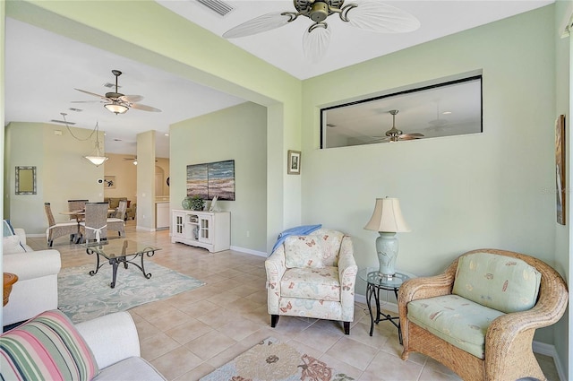 tiled living room featuring ceiling fan