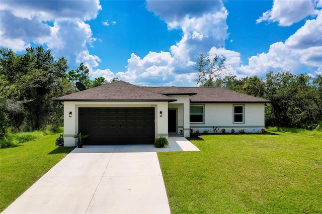 view of front of house with a garage and a front yard