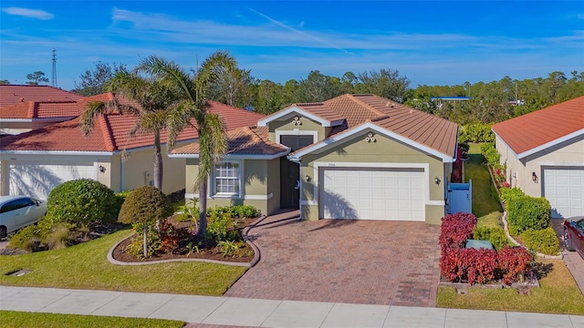 view of front of house featuring a garage and a front yard