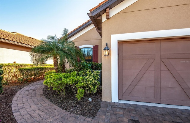 entrance to property featuring a garage