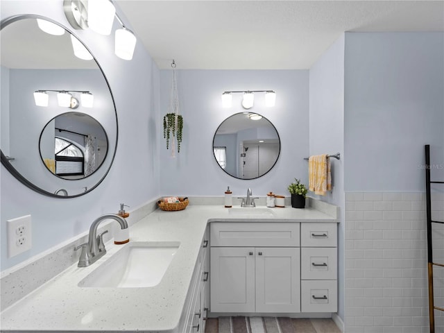 bathroom with double vanity and a sink