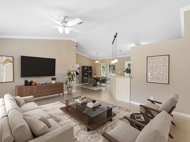 living room with ornamental molding, vaulted ceiling, ceiling fan, and light tile patterned floors