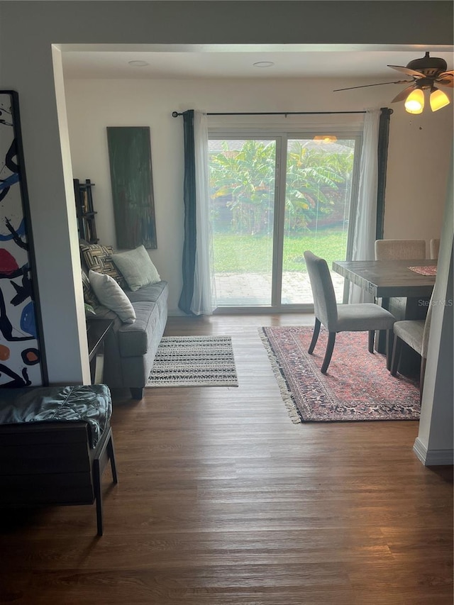 living room with plenty of natural light and dark hardwood / wood-style floors