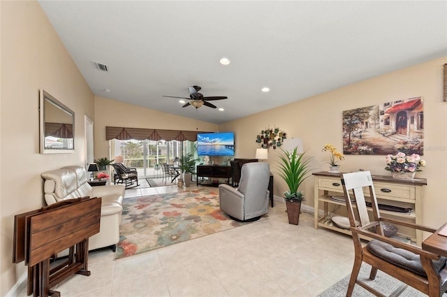 living room featuring lofted ceiling, light tile patterned floors, and ceiling fan